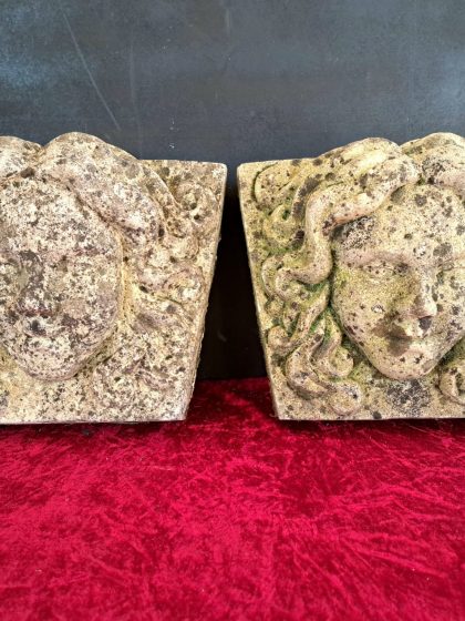pair of antique stne face plaques (10)