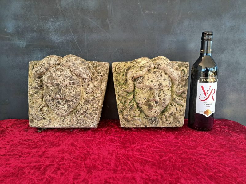 pair of antique stne face plaques (6)